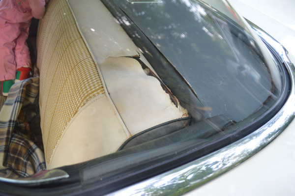Torn vinyl back seat
